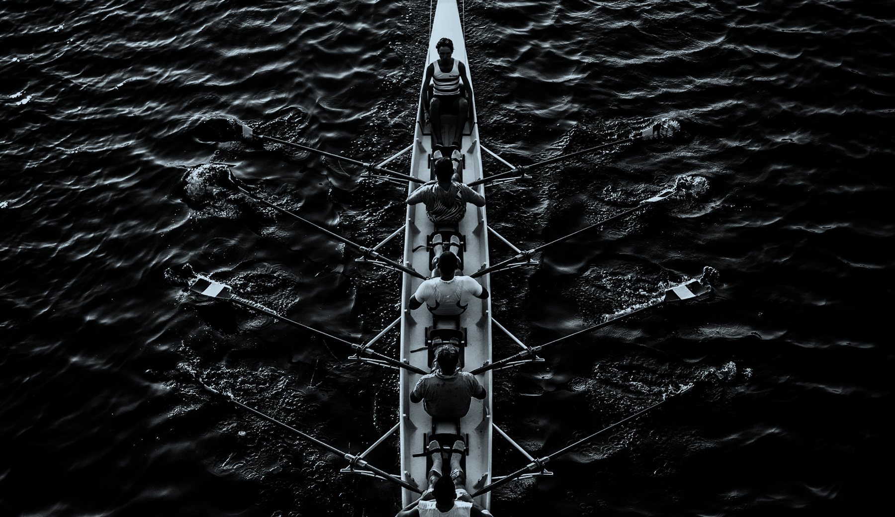 A rowing eight moving in unison